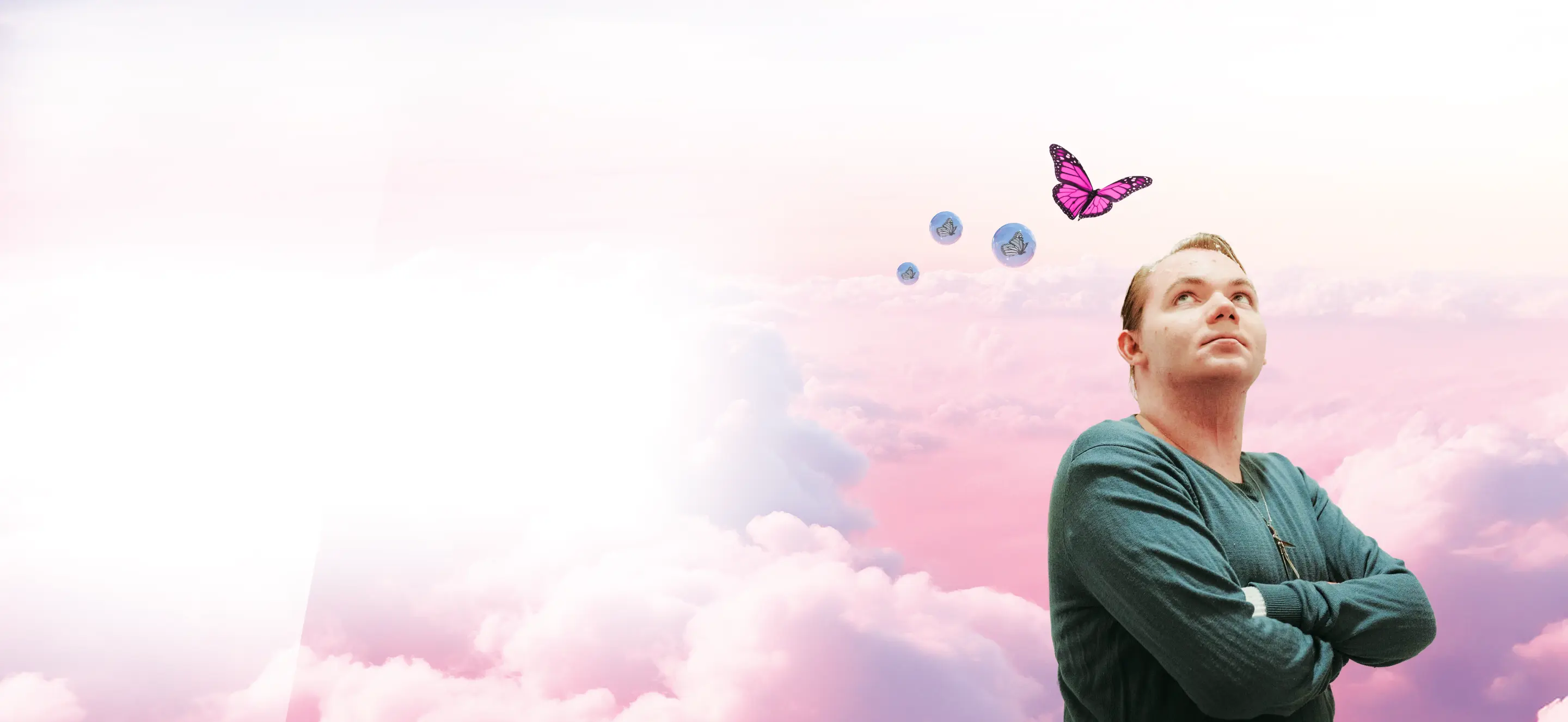 Patient ambassador looking up at butterflies and bubbles